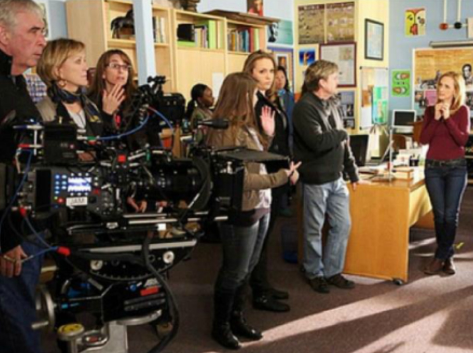 Amanda McDonough with the cast behind the scenes of Switched At Birth