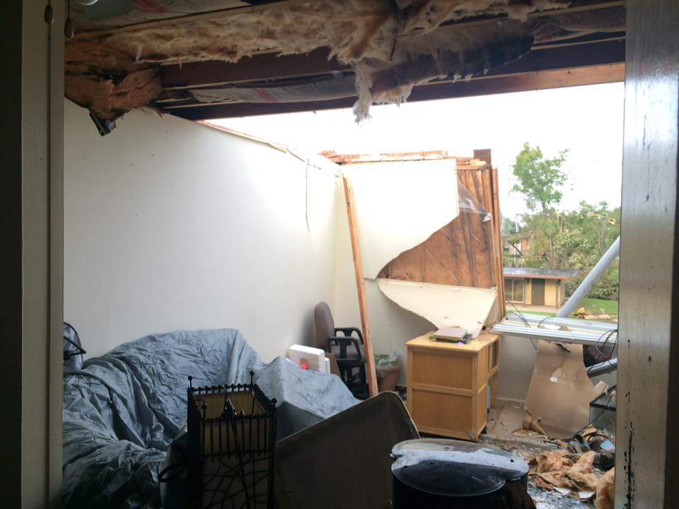 Amy Brock McNew's home was damaged in a tornado, roof torn off, with resilience expert Elizabeth Van Tassel.