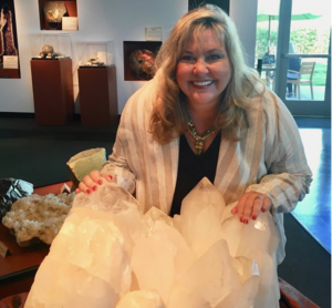 Middle Grade author and gemologist Elizabeth Van Tassel with quartz gems.